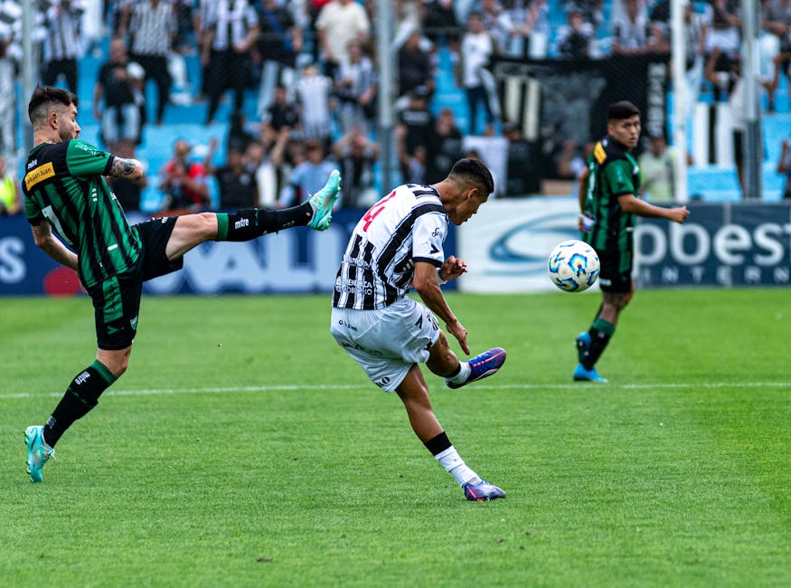 Action-packed soccer game with players competing vigorously on a green field.